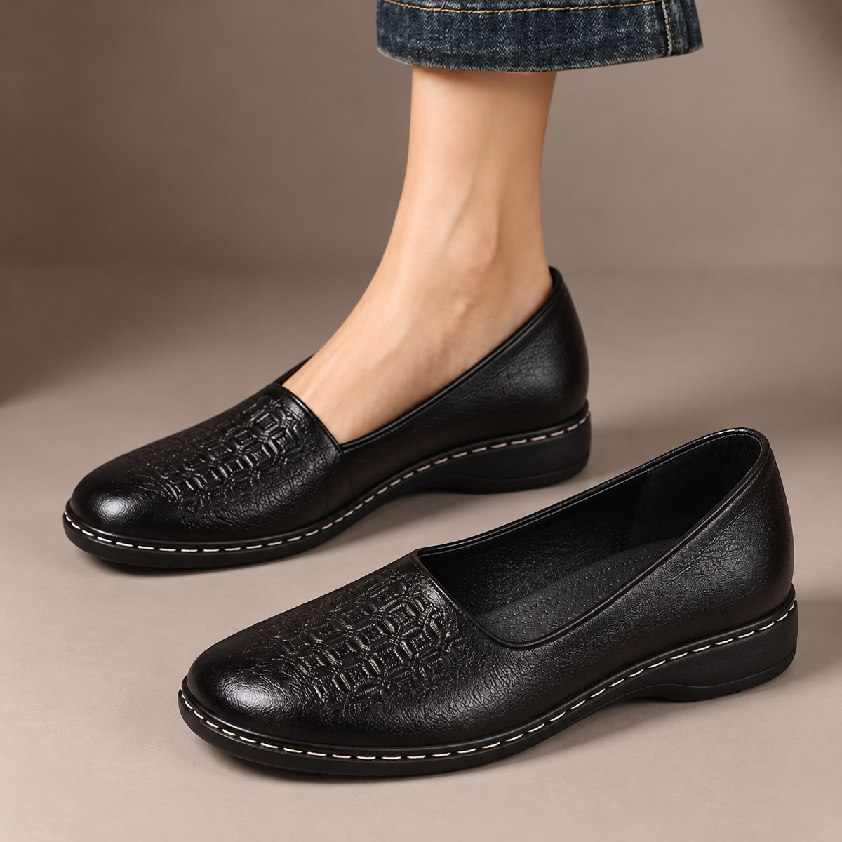Beatrice™ | Patterned Comfort Slip-Ons — one worn shoe and one matching shoe in a taupe studio