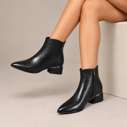 Cressida™ | Pointed-Toe Low Heel Ankle Boots in Black, worn in a beige studio