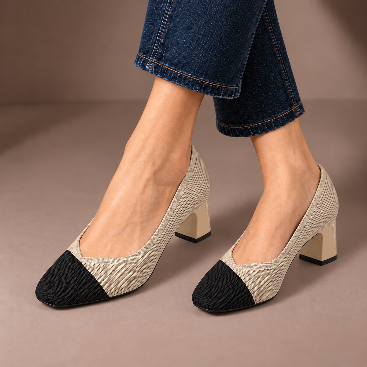 Mariella apricot & black ribbed knit court shoes with square heels, worn with dark jeans in a taupe studio