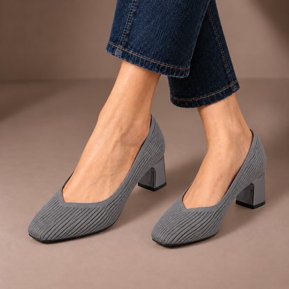 Mariella grey ribbed knit court shoes with square heels, worn with dark jeans in a taupe studio