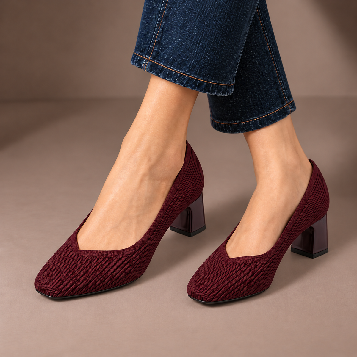 Mariella burgundy ribbed knit court shoes with square heels, worn with dark jeans in a taupe studio
