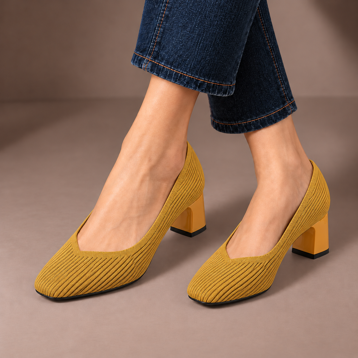 Mariella yellow ribbed knit court shoes with square heels, worn with dark jeans in a taupe studio
