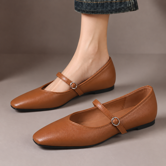 Violet™ | Classic Mary Jane Flats — one worn shoe and one matching shoe in a taupe studio