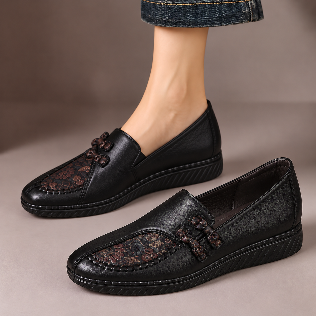Winifred™ | Floral Detail Comfort Loafers — one worn shoe and one matching shoe in a taupe studio
